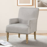 Upholstered Accent Chair with Recessed Arms, Nailhead Trim and Turned Legs